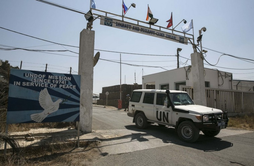 A U.N. vehicle leaves a U.N. base in the Israeli-occupied Golan Heights. (photo credit: REUTERS)