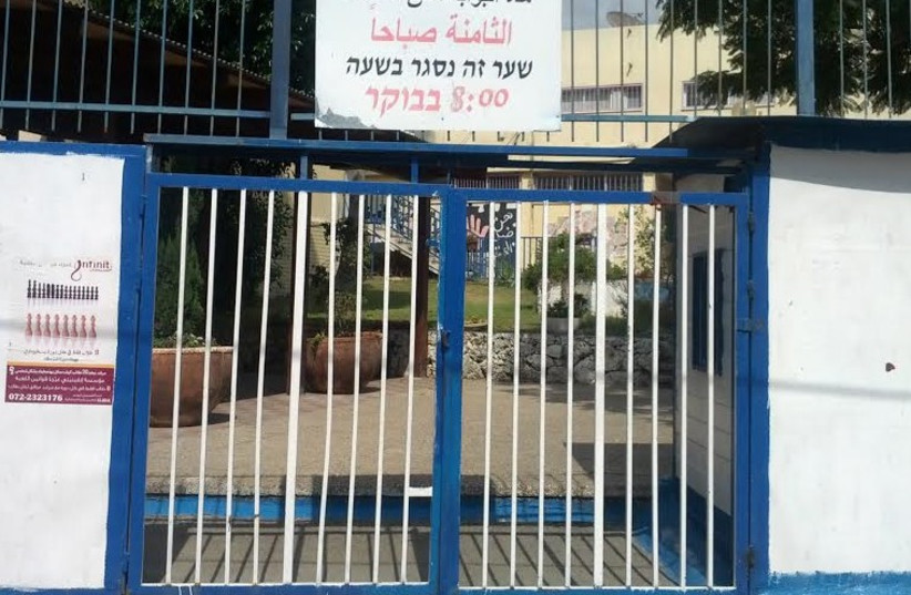 Closed school gate in Taibe (photo credit: Ariel Ben Solomon)
