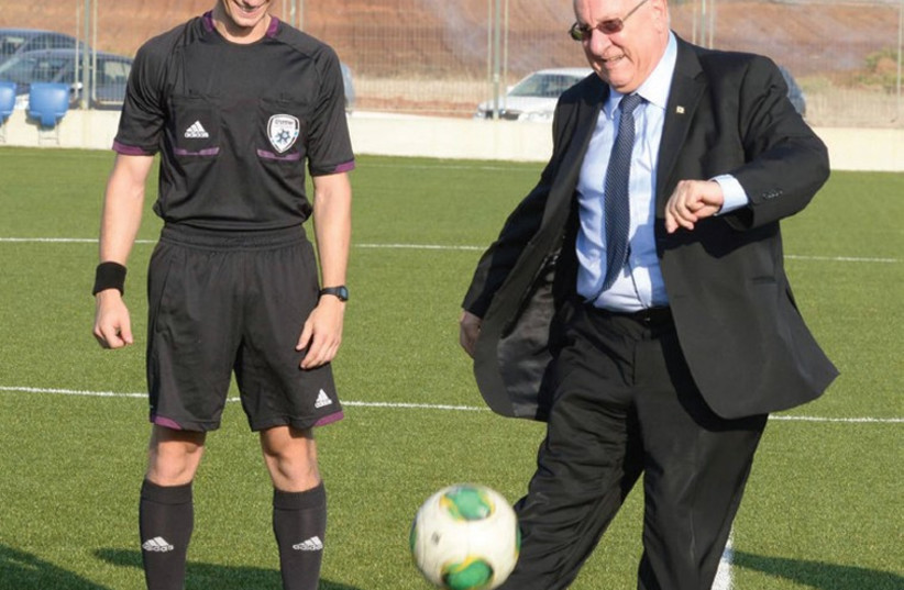 PRESIDENT REUVEN RIVLIN is on the ball. (photo credit: Courtesy)