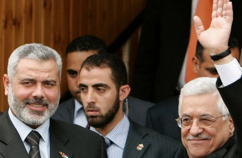 Hamas deputy political bureau chief Ismail Haniyeh (L) and Palestinian Authority President Mahmoud Abbas. (photo credit: REUTERS)