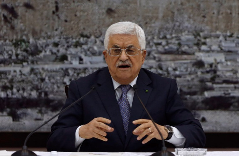Palestinian Authority President Mahmoud Abbas gestures during a meeting with Palestinian leadership in the West Bank city of Ramallah (photo credit: REUTERS)
