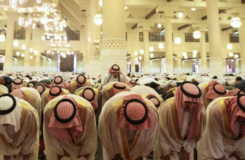 Saudis take part in Friday prayers. (photo credit: REUTERS)