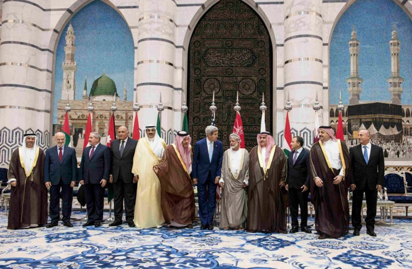 US Secretary of State John Kerry (C) poses with his Arab counterparts in Jeddah September 11, 2014.  (photo credit: REUTERS)