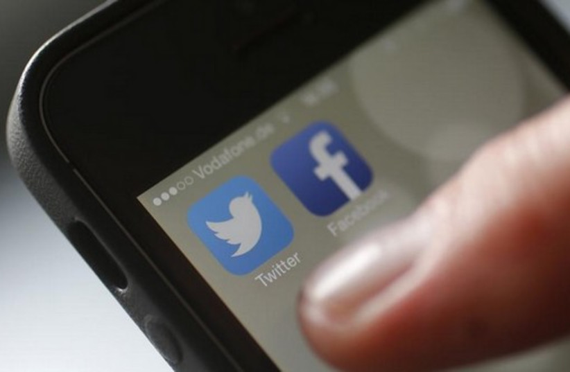 Social media apps Twitter and Facebook [Illustrative] (photo credit: REUTERS)