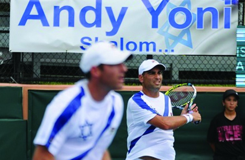 Andy Ram (right) and Yoni Erlich (left) recorded a thrilling five-set victory over Argentina’s Horacio Zeballos and Federico Delbonis in their final match together last night in Sunrise, Florida, giving Israel a 2-1 lead over Argentina in the World Group playoff tie. (photo credit: GADI/ITA)