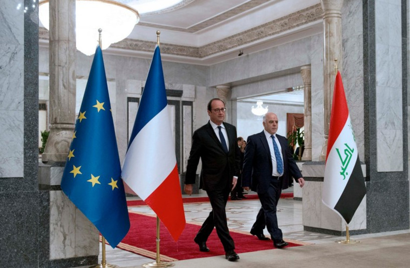 Iraq's Prime Minister Haider al-Abadi (R) and French President Francois Hollande arrive for a press meeting in Baghdad September 12, 2014. (photo credit: REUTERS)
