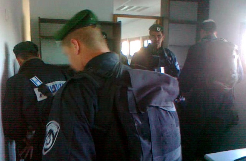 Police in the Od Yosef Chai yeshiva in April when the building was first commandeered (photo credit: COURTESY HAKOL HAYEHUDI)