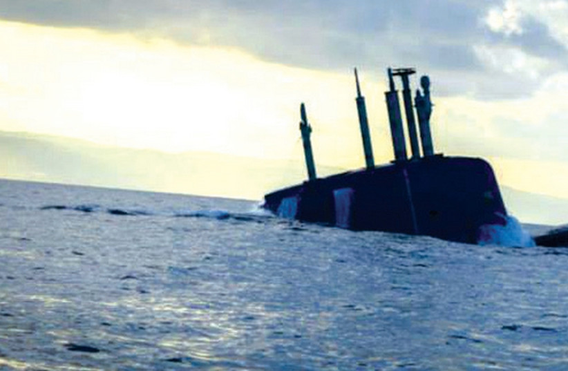 A Dolphin-class submarine broaches in the Mediterranean Sea near Haifa. (photo credit: IDF SPOKESMAN’S UNIT)