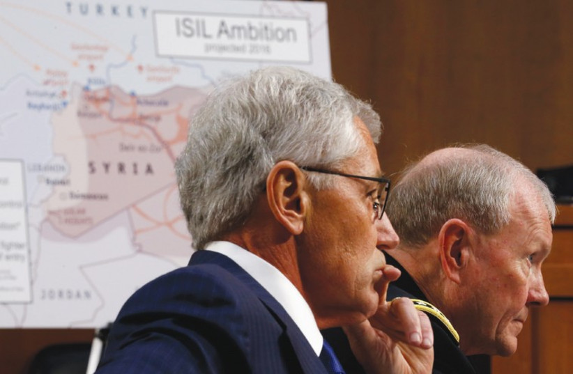 US SECRETARY of Defense Chuck Hagel (left) and Chairman of the Joint Chiefs of Staff Gen. Martin Dempsey testify yesterday during the Senate Armed Services Committee hearing on US policy toward Iraq and Syria. (photo credit: REUTERS)