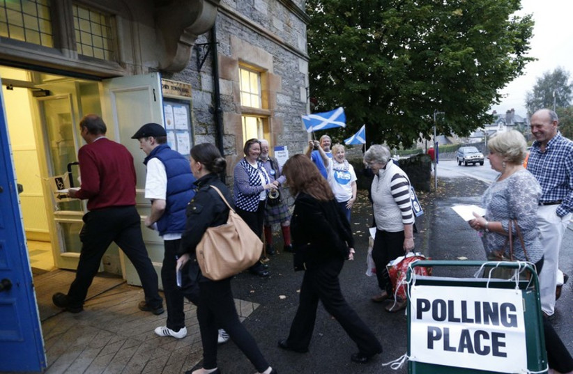 Scots vote in independence referendum (photo credit: REUTERS)