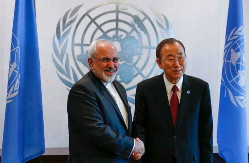 United Nations Secretary General Ban Ki-moon shakes hands with Iranian Foreign Minister Mohammad Javad Zarif at UN headquarters in New York, September 18 (photo credit: REUTERS)