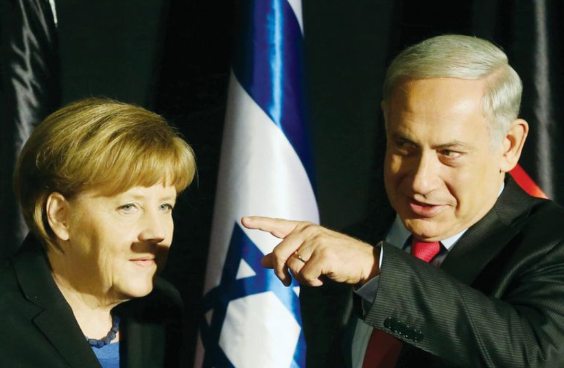 PM Netanyahu points and shadows Angela Merkel's lip, (photo credit: MARC ISRAEL SELLEM/THE JERUSALEM POST)