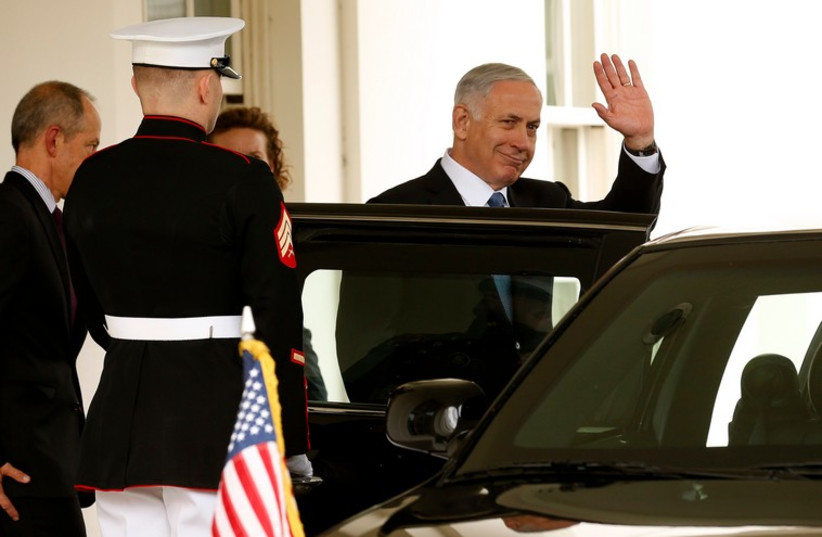 Prime Minister Binyamin Netanyahu waves as he departs the White House after his meeting with US President Barack Obama, October 1, 2014 (photo credit: REUTERS)