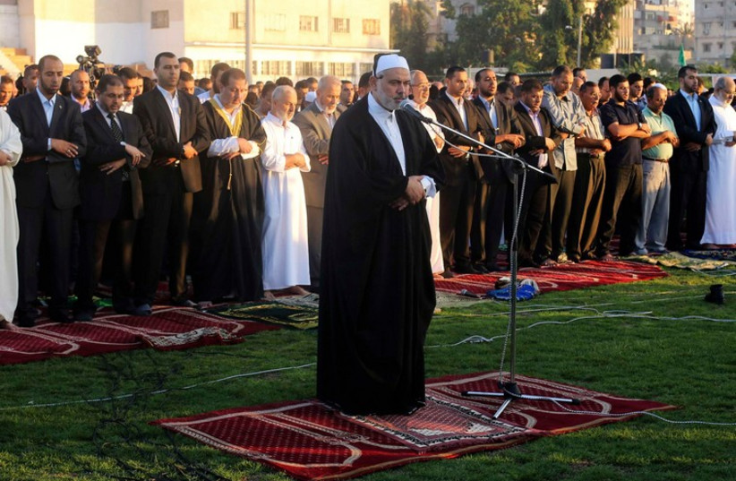 Hamas leader Ismail Haniyeh leads Eid al-Adha prayers in Gaza City (photo credit: REUTERS)