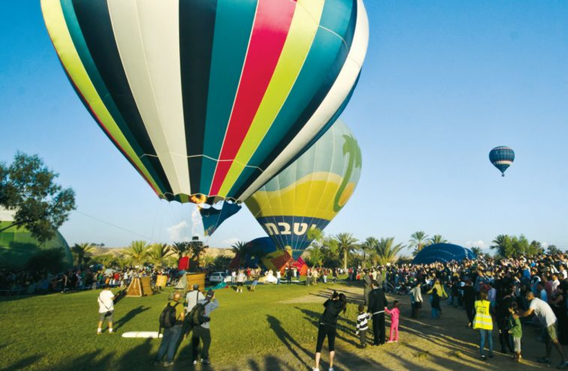 Hot-air balloons begin their ascent at the International Hot Air Balloon festival in the Northern Negev. (photo credit: DAN BARCELO)