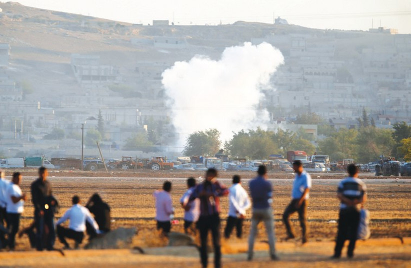 SMOKE RISES from the Syrian town of Kobani (photo credit: REUTERS)