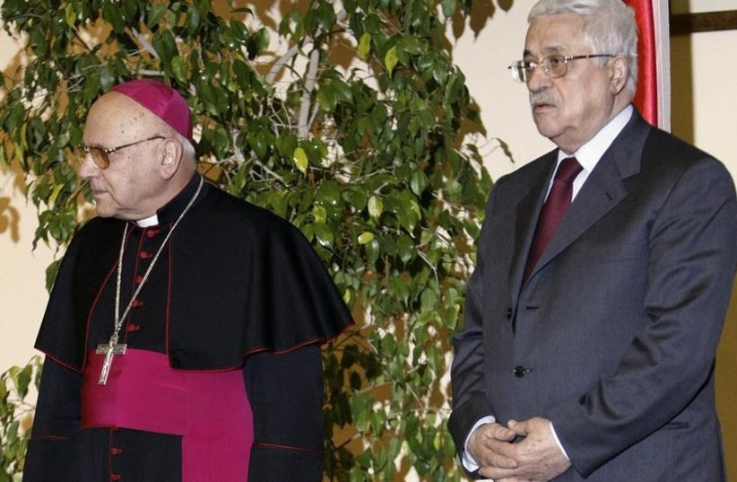 Former Latin Patriarch of Jerusalem Michel Sabbah (L) and PA President Mahmoud Abbas stand together during a meeting in Bethlehem in 2007. (photo credit: REUTERS)