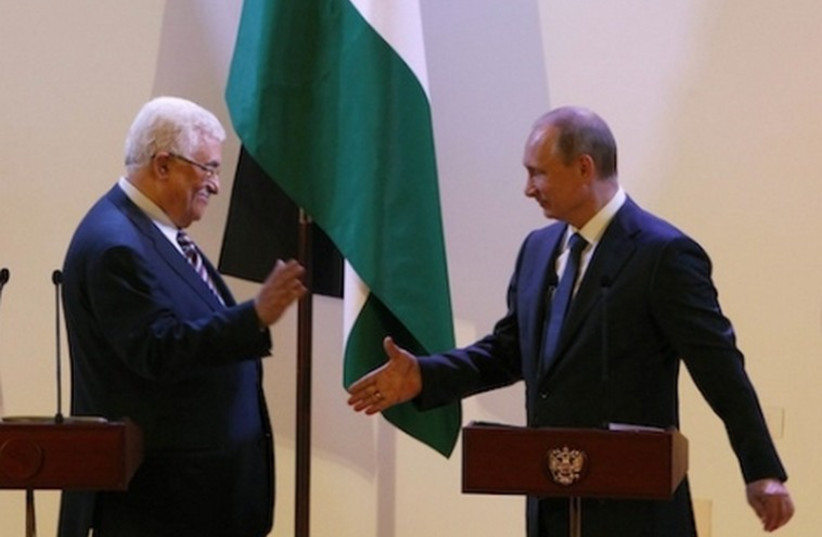 Russian President Vladimir Putin (R) and Palestinian Authority chief Mahmoud Abbas in Bethlehem (photo credit: REUTERS)