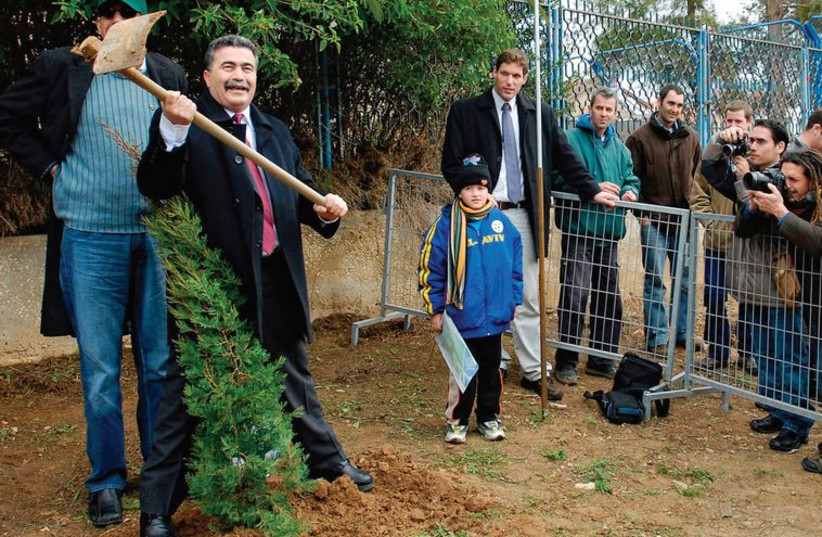 Amir Peretz and Mayor of Sderot Eli Moyal attend a tree planting ceremony in Sderot in February 2007. (photo credit: AMIR COHEN - REUTERS)