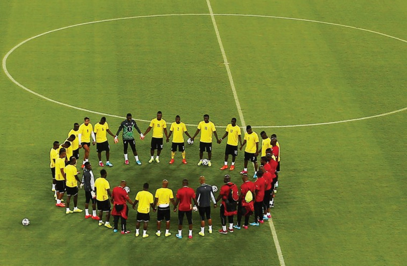Members of Ghana’s national soccer team gather in a circle before a training session for the Africa Cup of Nations, one of many venues Israeli security systems have played a role in protecting (photo credit: REUTERS)