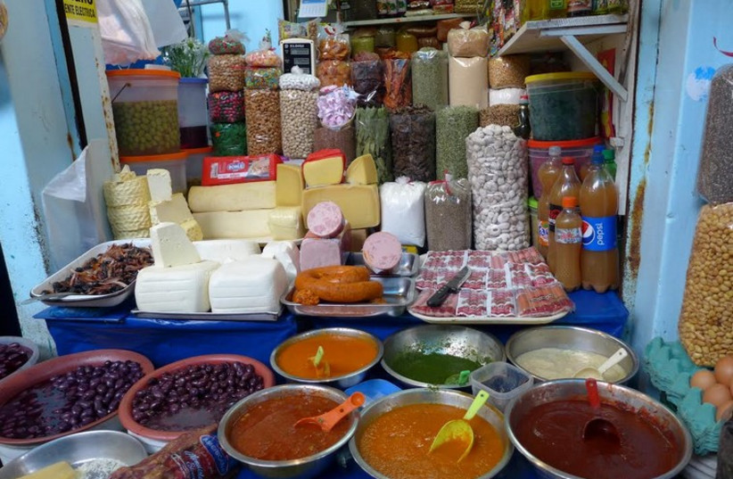 Pepper purees and other delicacies on sale at Mercado Surquillo, one of Lima’s main markets (photo credit: YAKIR LEVY)