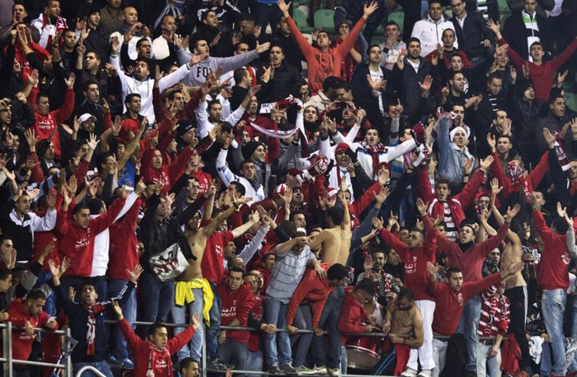 Fans of Bnei Sakhnin football team (photo credit: REUTERS)