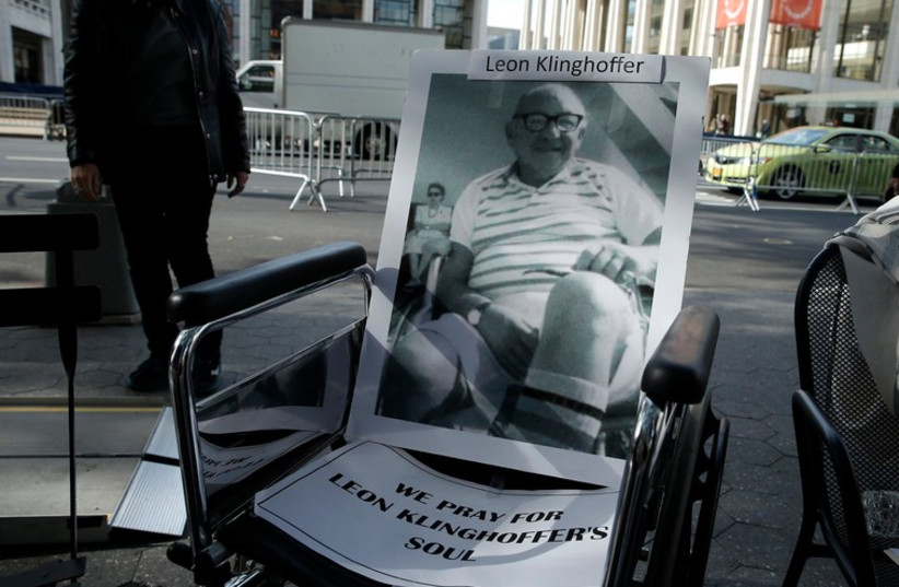 A wheelchair with a photograph of the late Leon Kilnghoffer sits across from the New York Metropolitan Opera, in New York October 20, 2014. (photo credit: REUTERS)