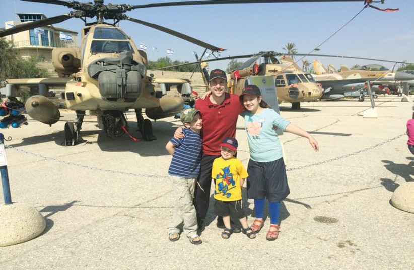 Elie Rosenblatt and his three children at the Air Force Museum near Beersheba. (photo credit: Courtesy)