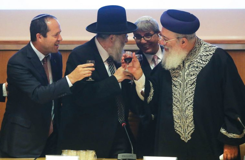 Mayor Nir Barkat shares a toast with chief rabbis Arye Stern and Shlomo Amar. (photo credit: MARC ISRAEL SELLEM/THE JERUSALEM POST)