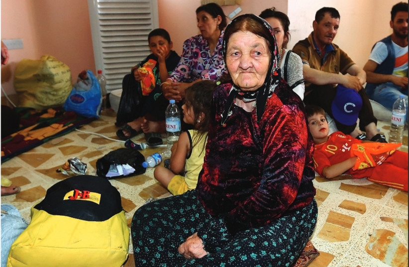 Three generations of a Christian family that fled from the violence in Mosul (photo credit: REUTERS)