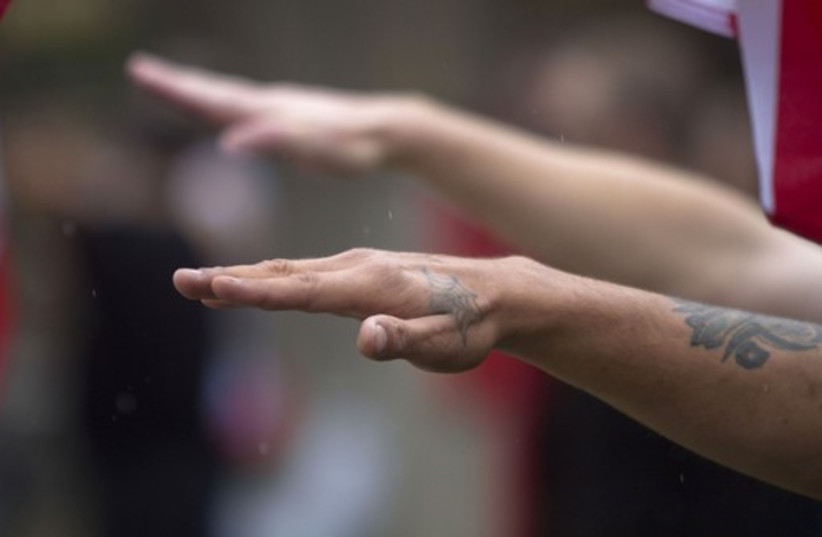 Man gives Nazi salute  (photo credit: REUTERS)