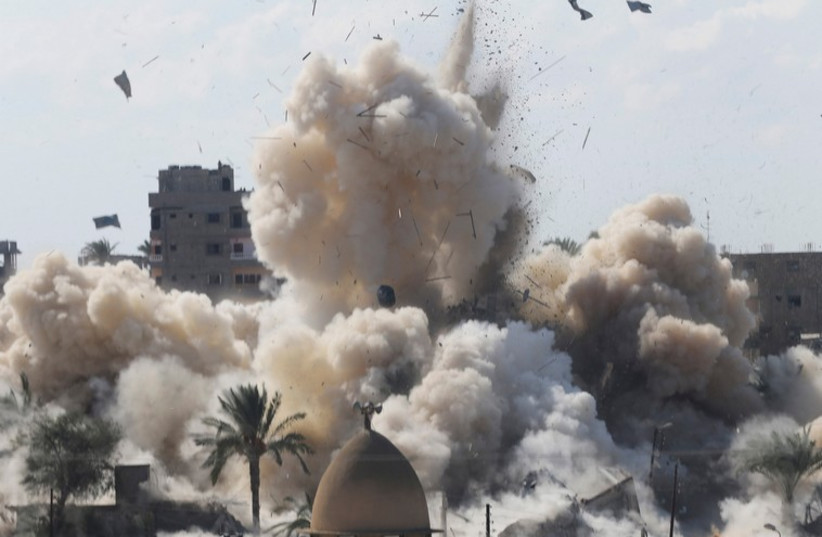 Egyptian security forces blow up a house in Rafah, near the border with Gaza October 29, 2014 (photo credit: REUTERS)