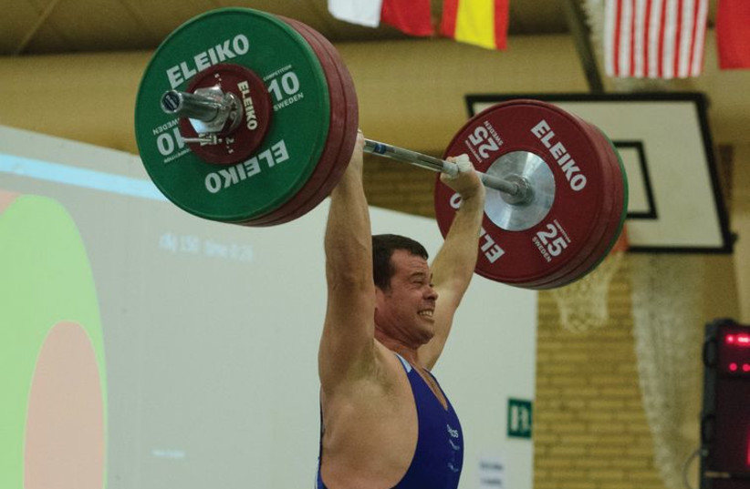 Project manager by day, world champion weightlifter by night (photo credit: Courtesy)