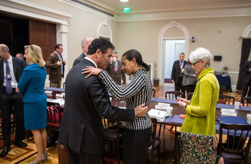 Susan Rice greets Yossi Cohen, National Security Advisor to Prime Minister Benjamin Netanyahu of Israel, prior to a meeting in the Eisenhower Executive Office Building of the White House (photo credit: COURTESY WHITE HOUSE)