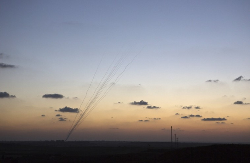 Smoke trails are seen as rockets are launched towards Israel from the northern Gaza Strip in July (photo credit: REUTERS)