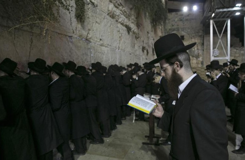 Religious Jews pray at the Western Wall (photo credit: REUTERS)