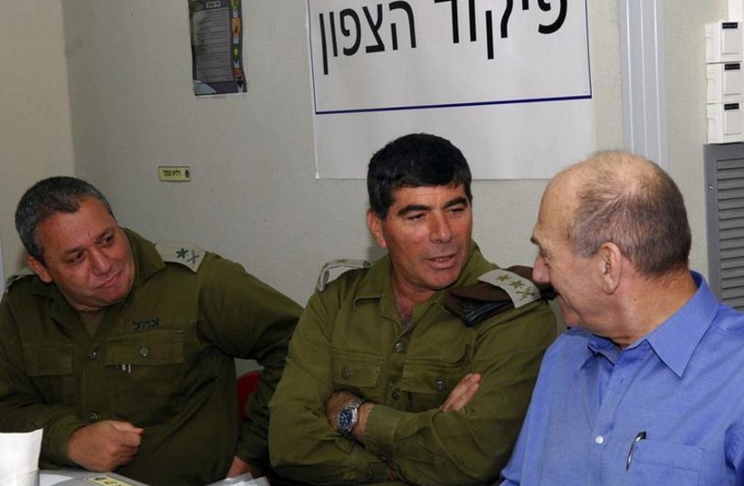 From left, Maj.-Gen. Gadi Eizenkot, former IDF chief of staff Gabi Ashkenazi, and former Prime Minister Ehud Olmert (photo credit: REUTERS)