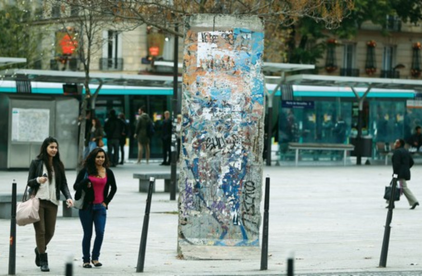 A SECTION of the Berlin Wall in Berlin. It was one of the iconic symbols of the Cold War (photo credit: REUTERS)