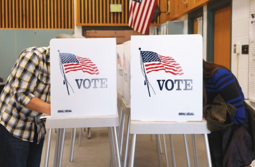 COLORADO RESIDENTS vote in the US midterm elections (photo credit: REUTERS)