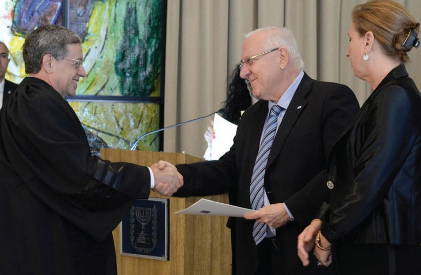NEW SUPREME COURT Justice Meni Mazuz is congratulated by President Reuven Rivlin as Justice Minister Tzipi Livni looks on (photo credit: Mark Neiman/GPO)