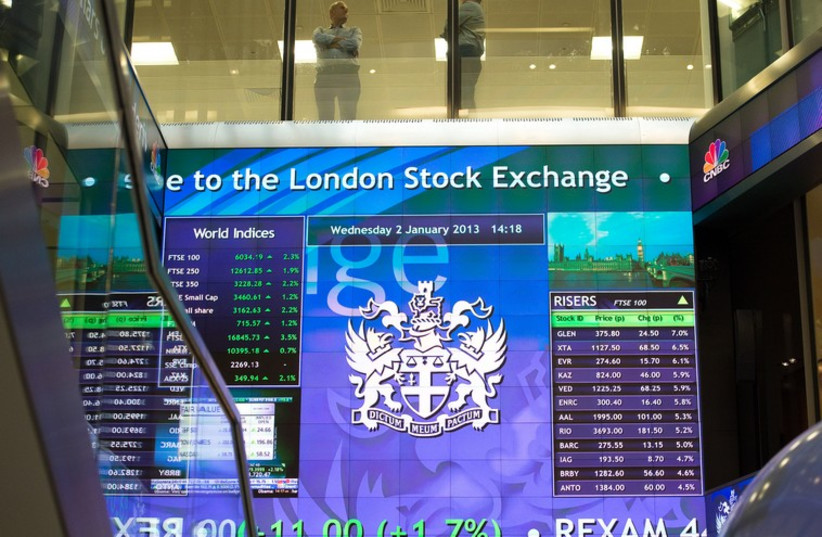 An electronic information board at the London Stock Exchange in the City of London (photo credit: REUTERS)