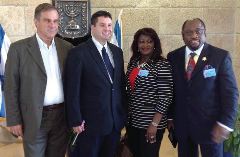 Pastor Myles Munroe (right) and his wife at the Knesset six weeks ago with Josh Reinstein (second left), the director of the Knesset Christian Allies Caucus, and Pastor Tom Hess (photo credit: KNESSET CHRISTIAN ALLIES CAUCUS)