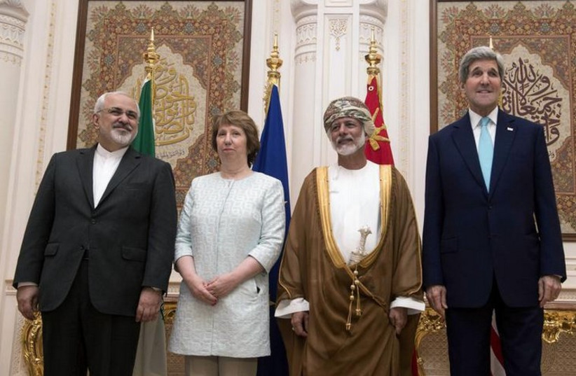 From left: Iranian Foreign Minister Javad Zarif, EU envoy Catherine Ashton, Omani Foreign Minister Yussef bin Alawi and US Secretary of State John Kerry (photo credit: REUTERS)