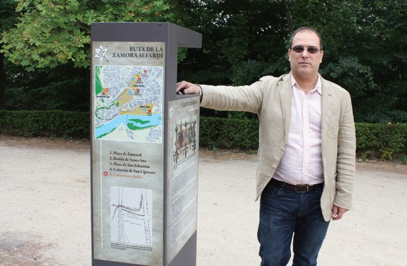 Prof. Jesus Jambrina poses next to the sign marking Zamora’s medieval Jewish cemetery, which is now a park. (photo credit: ALFREDO ALONSO)