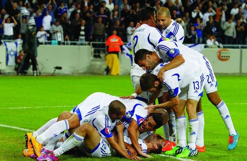 Israel’s players celebrate 3-0 win over Bosnia-Herzegovina at Sammy Ofer Stadium in Haifa (photo credit: ERAN LUF)