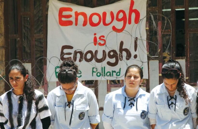 Young women in the Bnei Akiva youth movement wear mock prison outfits to protest the continued imprisonment of Jonathan Pollard, on July 4, 2011. (photo credit: MARC ISRAEL SELLEM/THE JERUSALEM POST)