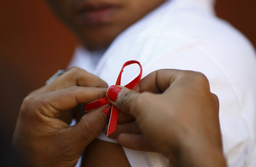 AIDS Ribbon (photo credit: REUTERS)