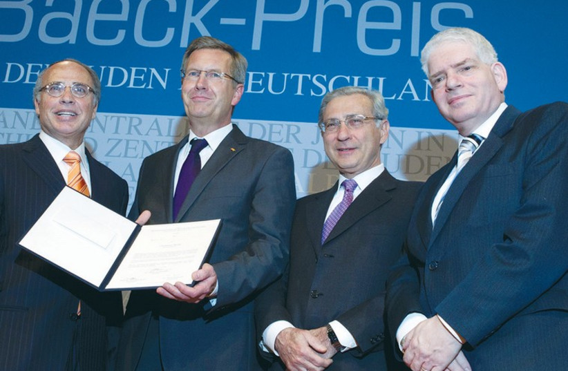  Josef Schuster (far right), with German President Christian Wulff (second from left) in 2011 (photo credit: THOMAS GOOD)