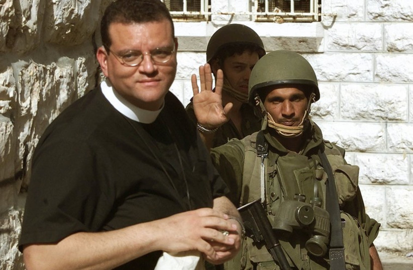 Canon Andrew White, a Christian archbishop from England, as he is turned away by an IDF soldier from entering Bethlehem (photo credit: REUTERS)