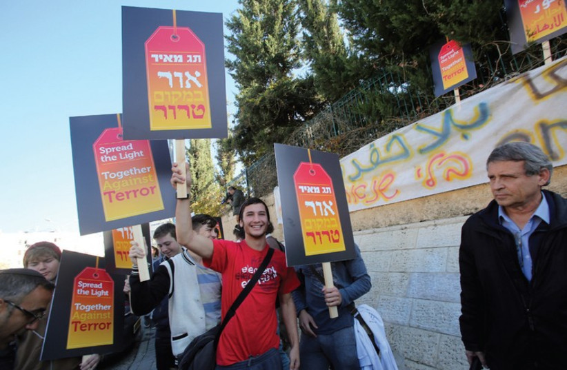 Tag Meir activists carrying signs of support (photo credit: COURTESY TAG MEIR)